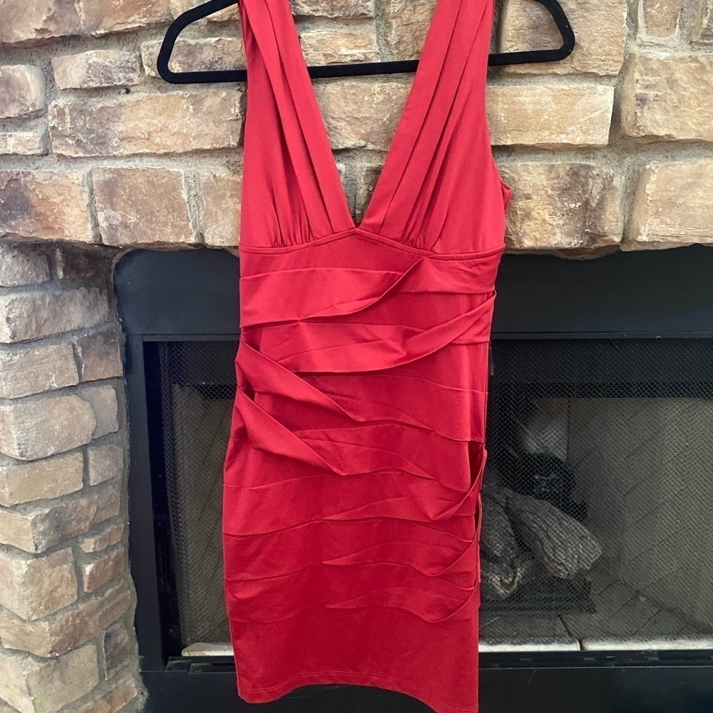 NWOT Nikibiki red, with layered ruffles. Size medium